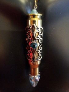 Bullet necklace with blue Swarovski crytal filagree.